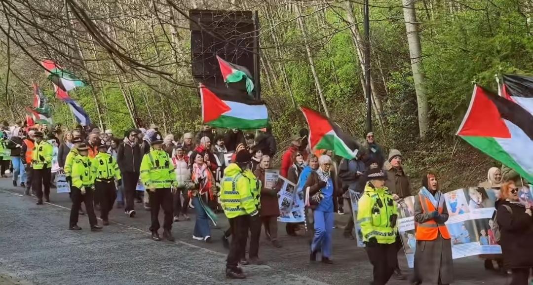Comrades on their march towards Rafael-owned Factory